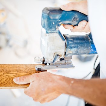 male-industrial-worker-builder-working-with-punhtuf.jpg